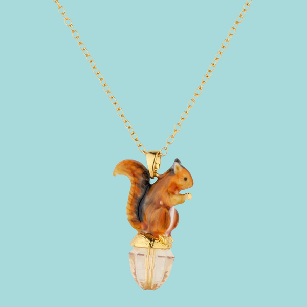 a necklace with a squirrel on top of it