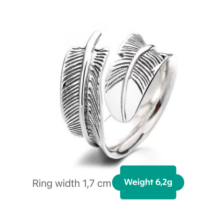 a ring with a feather design on it