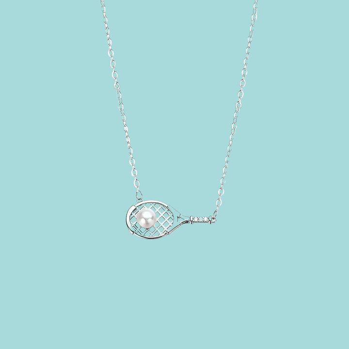 a tennis racket necklace on a blue background